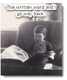 Gail Terry Grimes as baby reading the newspaper.